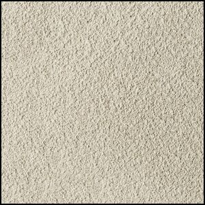 Close-up of a textured, light beige surface resembling sandpaper or rough plaster, with a consistent grainy appearance across the entire image.