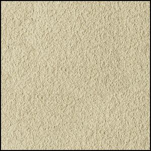 Close-up view of a beige, sandy, and slightly rough textured surface, resembling fine sandpaper or compacted sand.