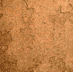 A close-up view of a textured, reddish-brown surface that resembles dry, cracked soil or clay. The surface has irregular patterns and various shades of brown.