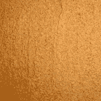 Close-up of a textured brown powder, possibly a spice such as cinnamon or ground ginger, spread evenly across the surface.
