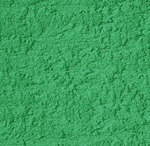Bright green textured powder spread out evenly, creating a rough, grainy surface. The image shows no distinct shapes or objects, just the vibrant green color and uneven texture throughout.