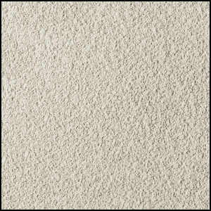 A close-up view of a textured, light beige carpet with a soft and slightly rough surface. The image shows a uniform, dense pattern of fibers.