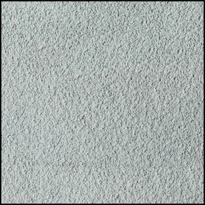 Close-up view of a light gray, textured surface resembling carpet or fabric, with a slightly speckled and soft, fibrous appearance.