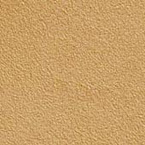 A close-up view of a surface with a sandy beige color and a slightly rough, textured appearance.