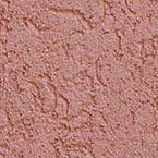 A close-up view of a textured, reddish-brown stucco or plaster wall with an uneven, rough surface and irregular patterns.